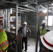 Visitors view construction of new, modern barracks building continues at Fort McCoy