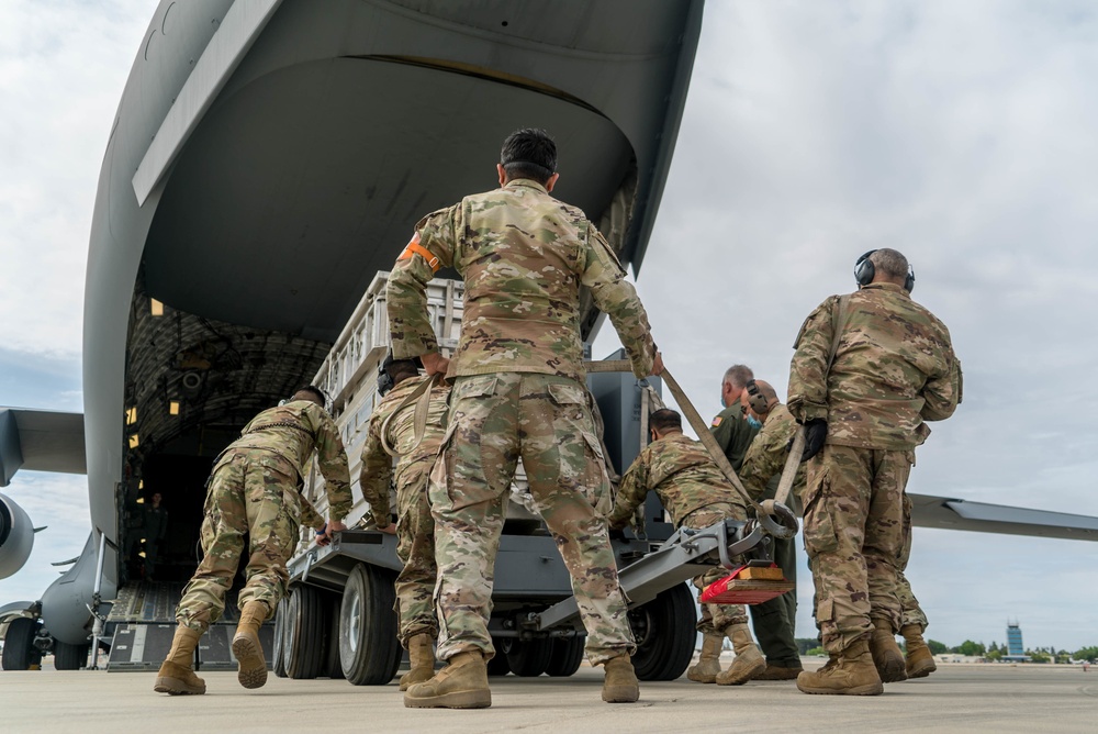 Aircrew from the 349th AMW move cargo as a part of exercise Nexus Dawn