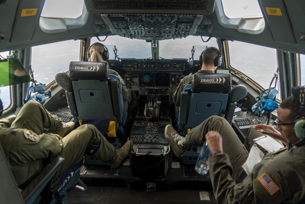 Aircrew from the 349th AMW move cargo as a part of exercise Nexus Dawn