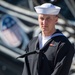 SN William Jones poses for a photo in front of USS Constitution.