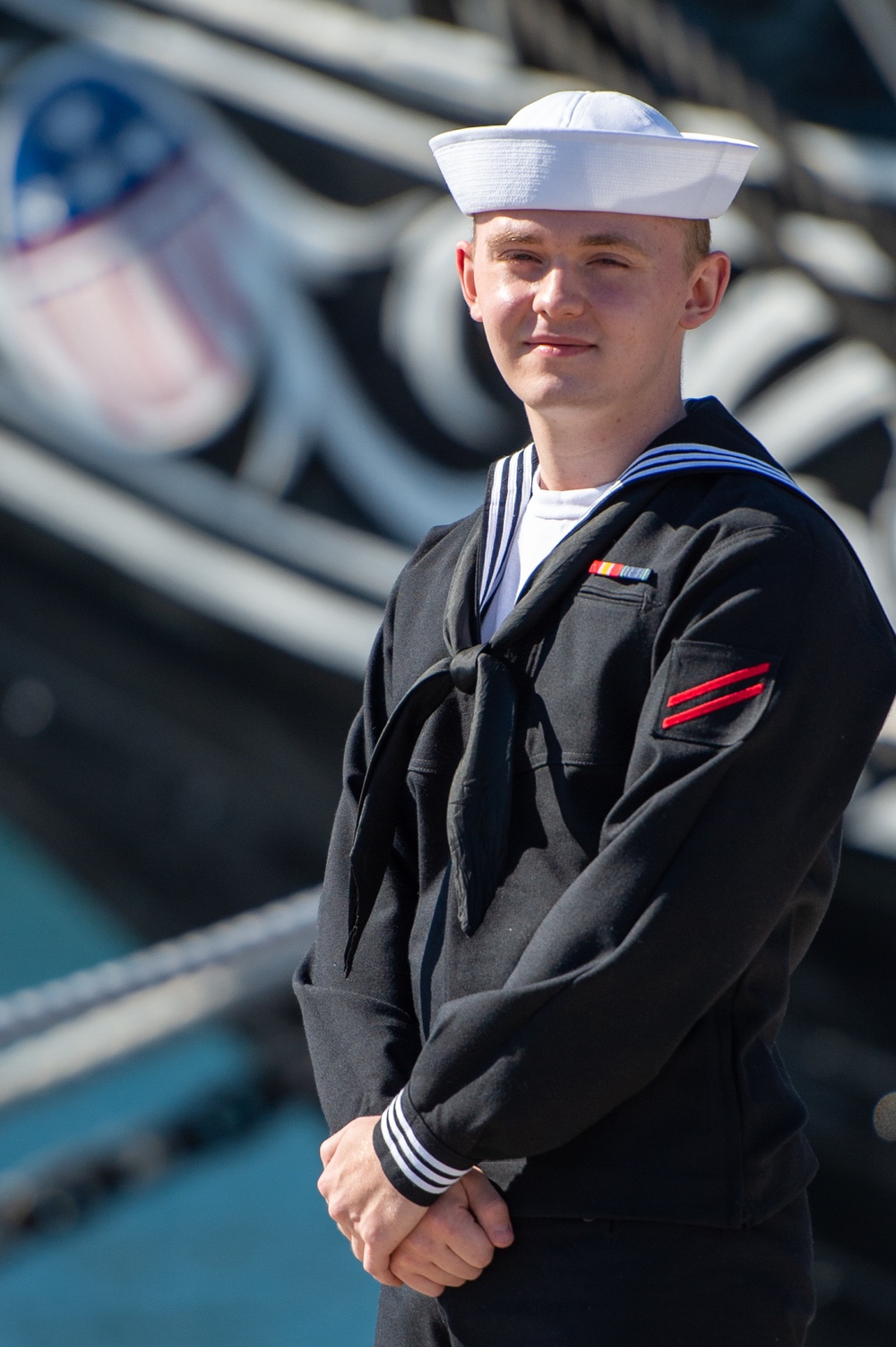 FN Skyler Brooks poses for a photo in front of USS Constitution.