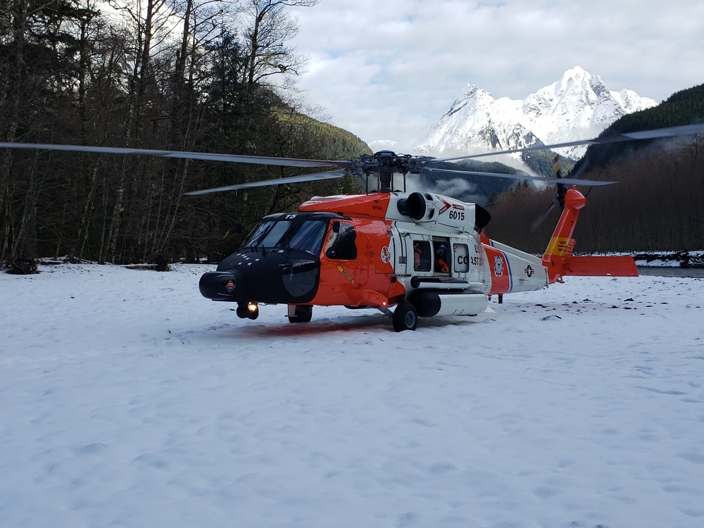 Coast Guard aircrew assists 3 stranded mariners, 2 dogs in the Gilkey River, Sunday