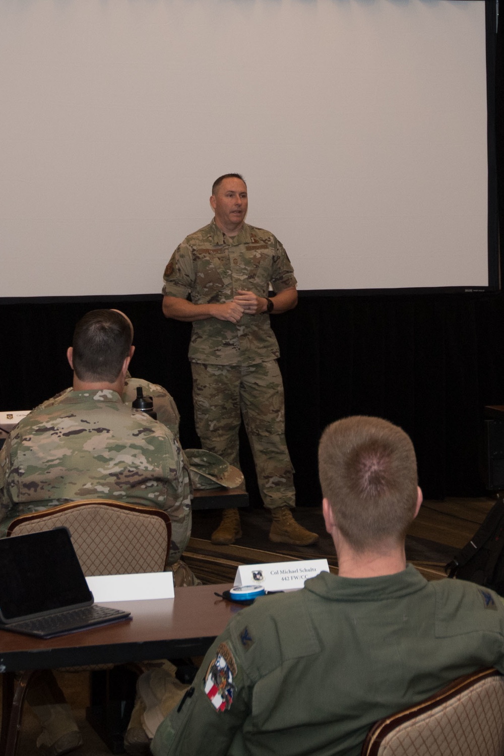 Chief Master Sgt Jeremy Malcom addresses wing commanders