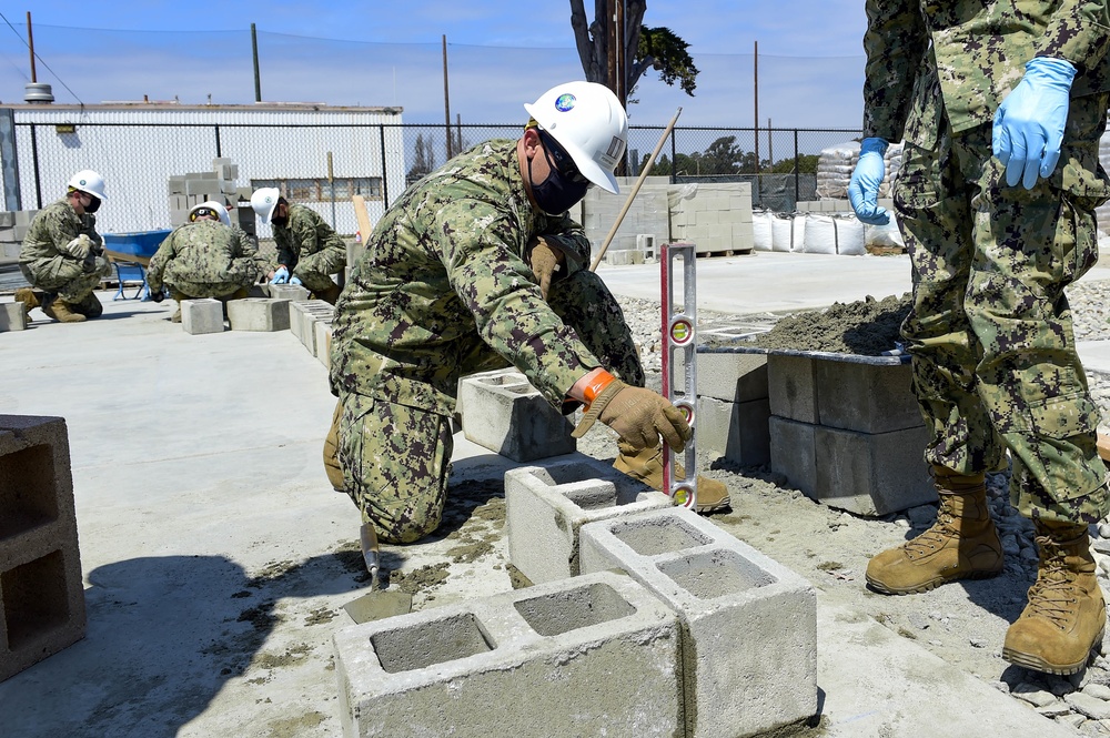 NMCB-3 Leadership Gets Hands Dirty Placing CMU Block