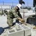 NMCB-3 Leadership Gets Hands Dirty Placing CMU Block