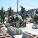 NMCB-3 Leadership Gets Hands Dirty Placing CMU Block