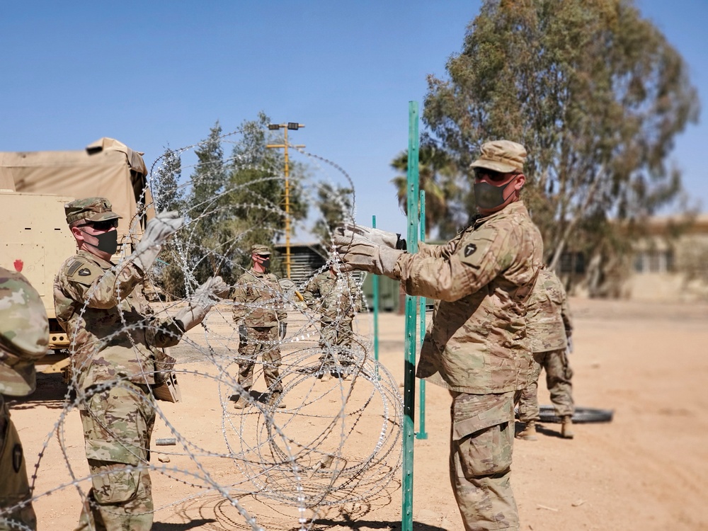 Soldiers Run Mile Long Concertina Wire