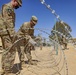 Deployed Soldiers Run Concertina Wire