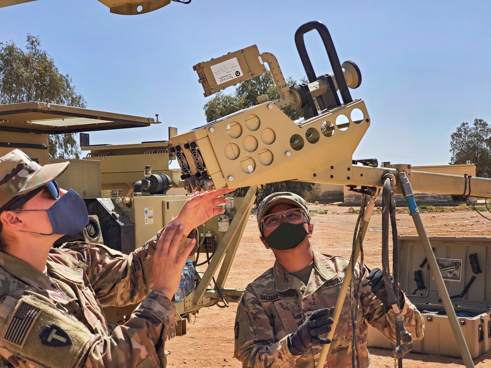 Texas Soldiers Assembles Satelite Dish in Desert