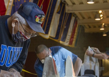Alaska National Guard armory honor pole restored by Vietnam veteran and son