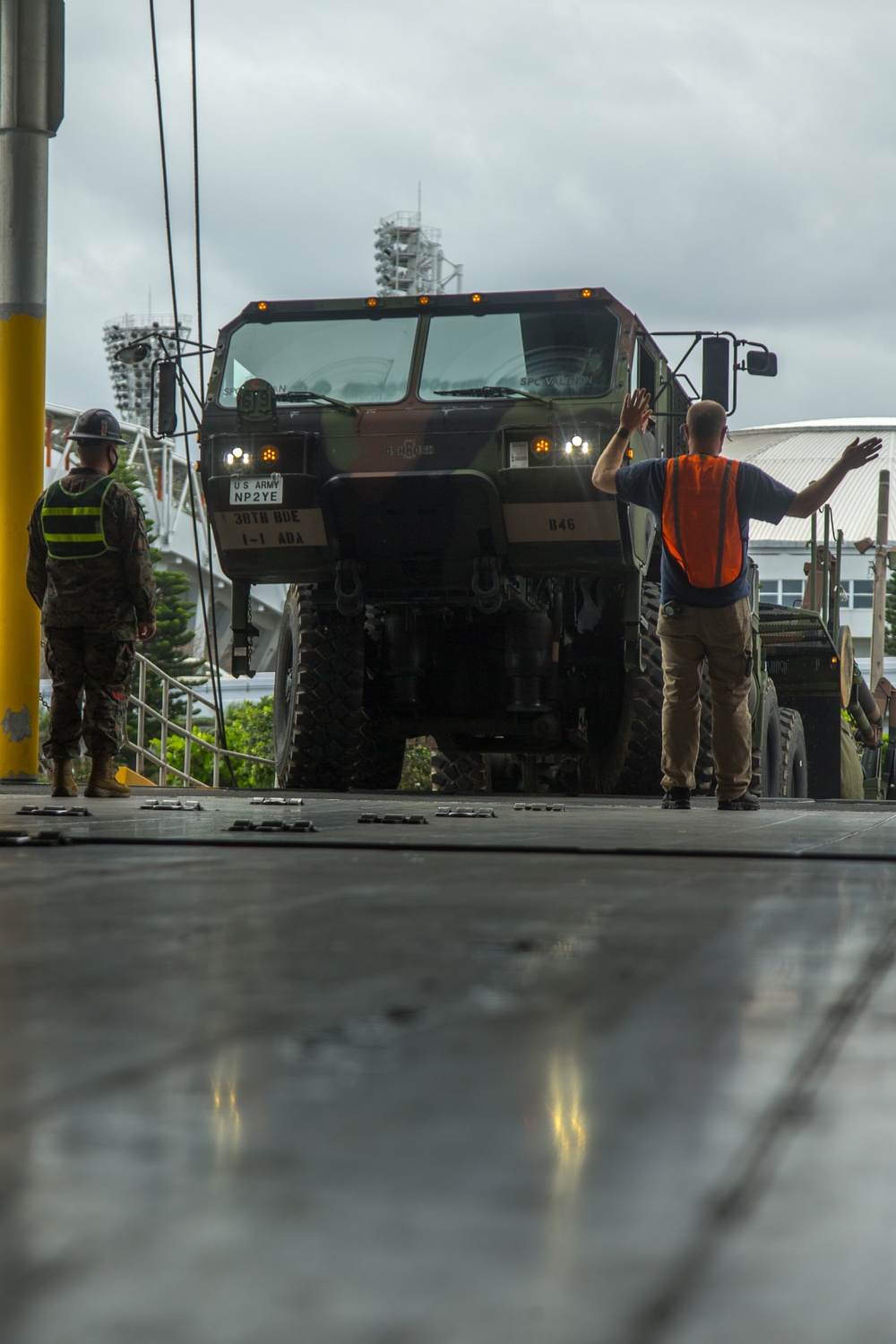 III Marine Expeditionary Force and U.S. Army 1st Battalion, 1st Air Defense Artillery, load cargo during Joint Mobility Exercise with USNS Guam