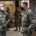 Maj. Gen. Michael C. O' Guinn talks with  Brig. Gen. Walter M. Duzzny at a private lunch