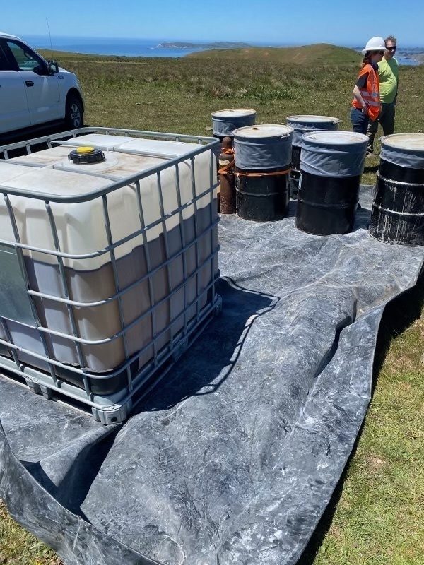 Contractors assess and remove pollution from the vessel American Challenger