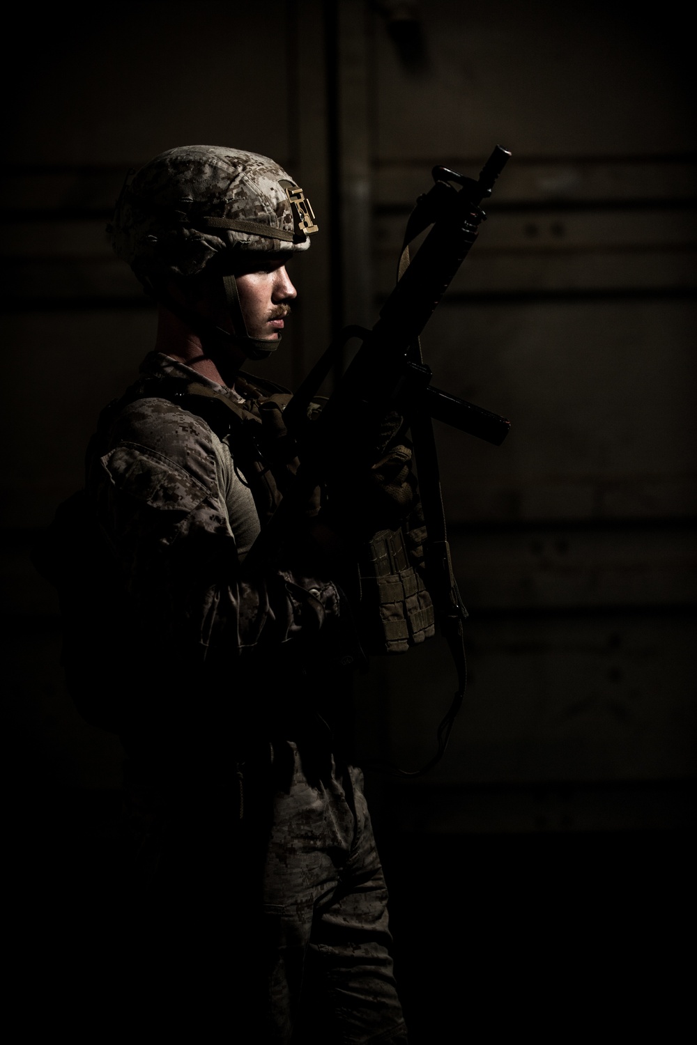 FASTCENT Marine Poses For Portraits After CQB Training 