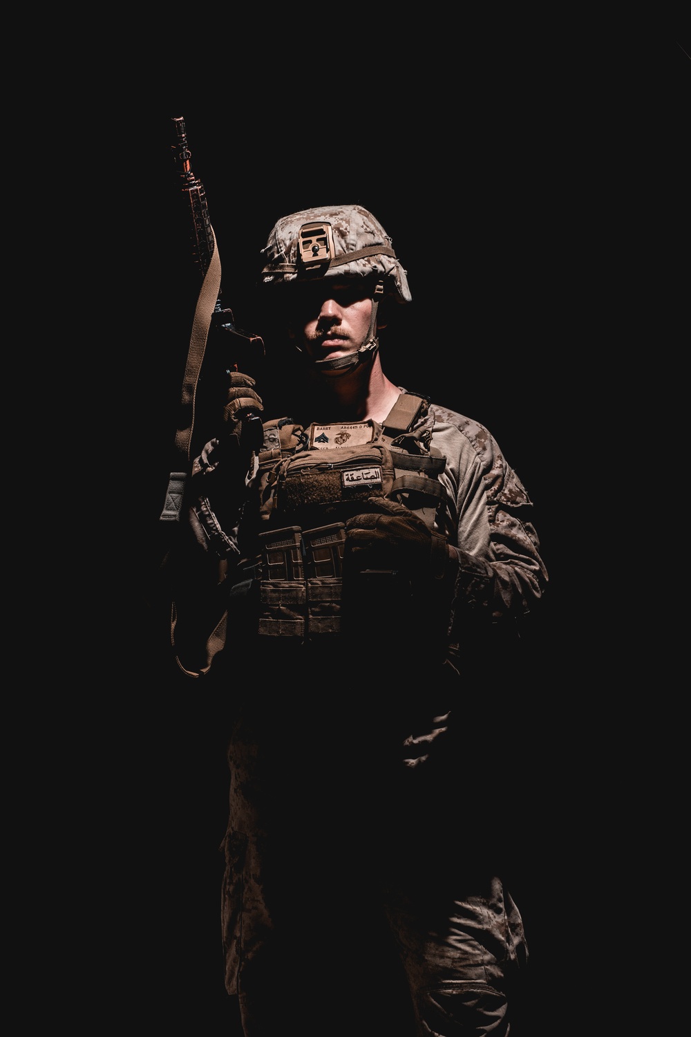 FASTCENT Marine Poses For Portraits After CQB Training 