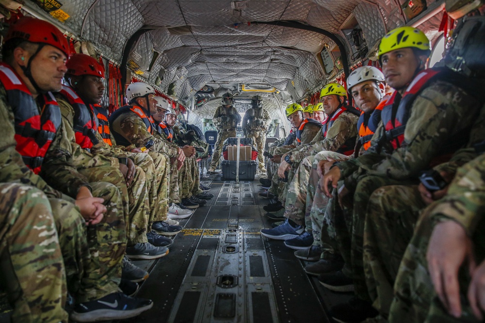 JTF-Bravo helocasts from CH-47 Chinook during overwater survival training