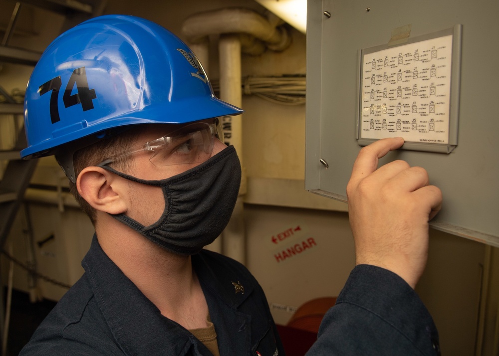 U.S. Sailor conducts maintenance