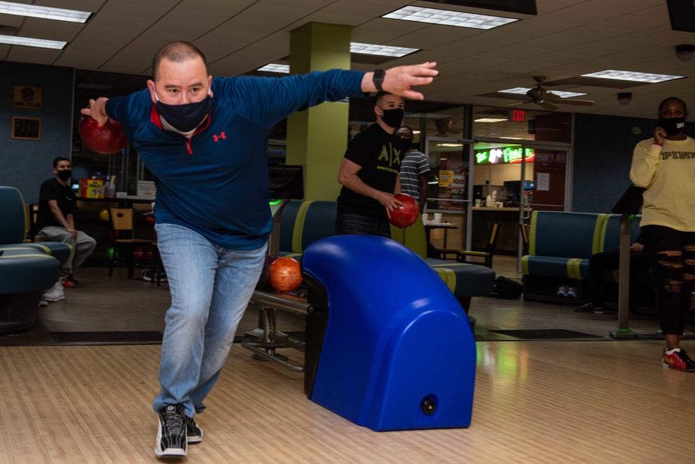 Chief participates in a Morale, Welfare, and Recreation bowling trip
