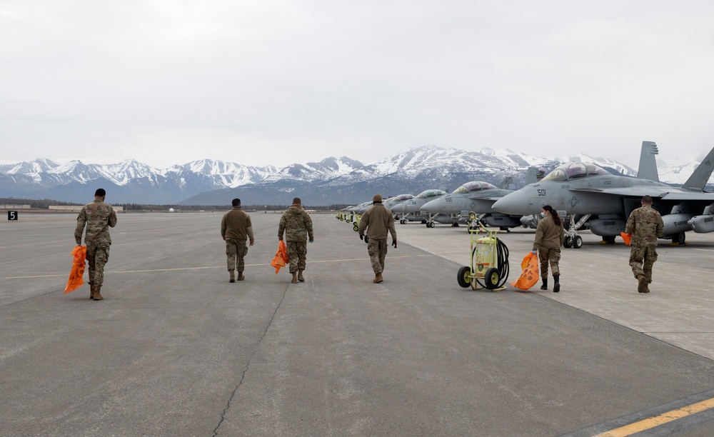 JBER Airmen conduct foreign object debris walk