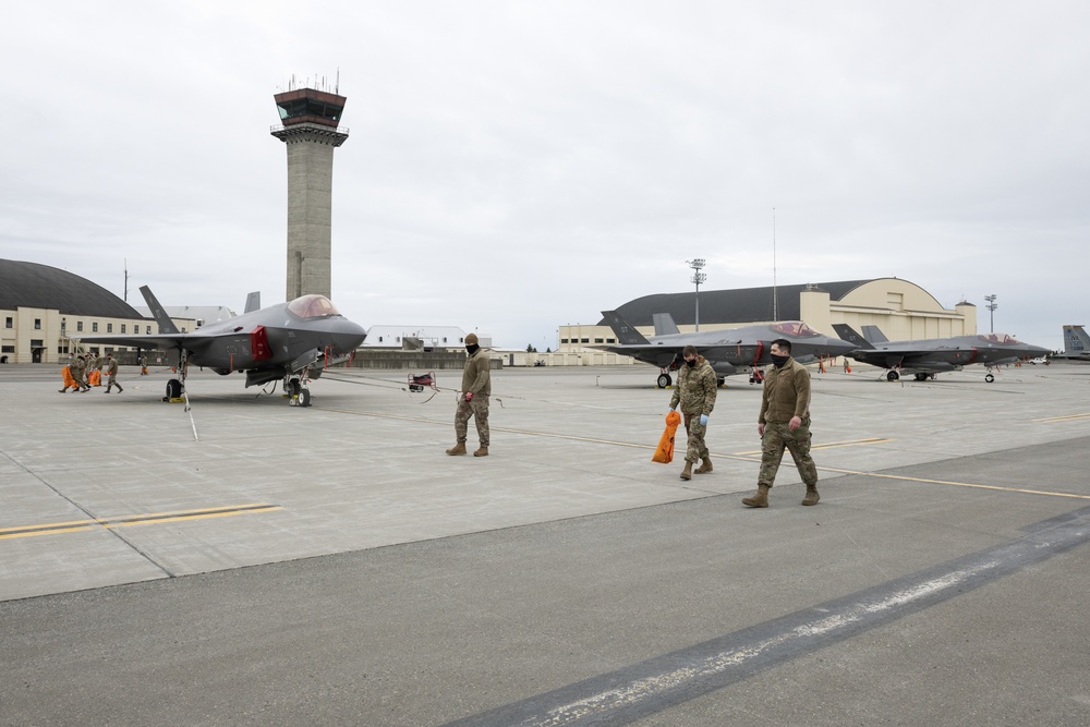 JBER Airmen conduct foreign object debris walk