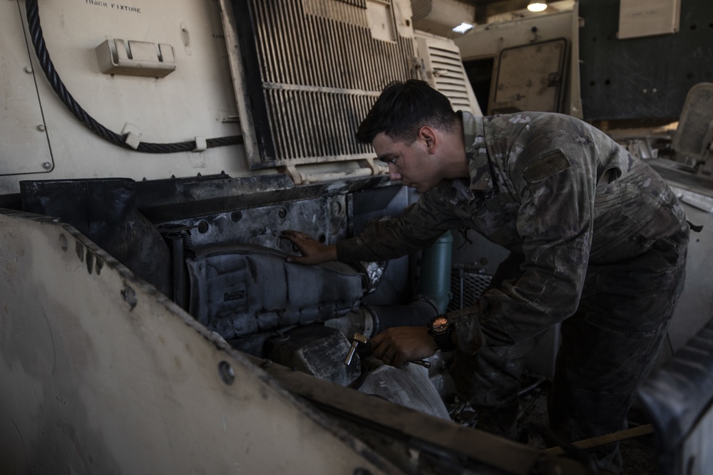 16th Field Artillery Regiment Mechanics Work on an Armored Vehicle