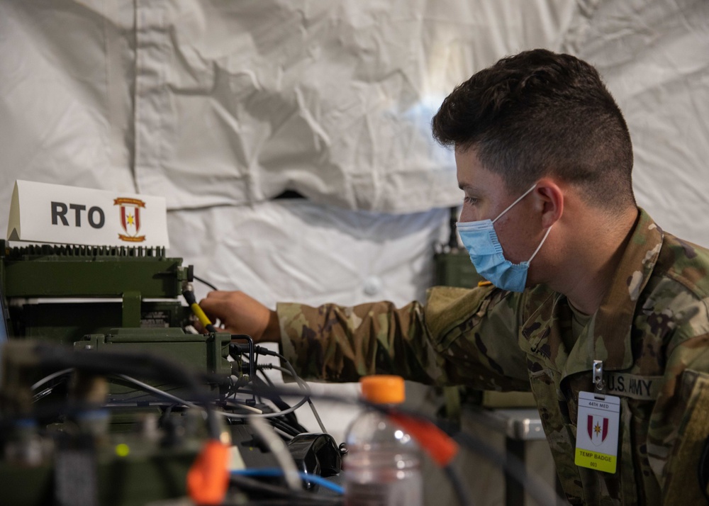 44 Medical Brigade Radio Operator Conducts Communication Checks During GR 21
