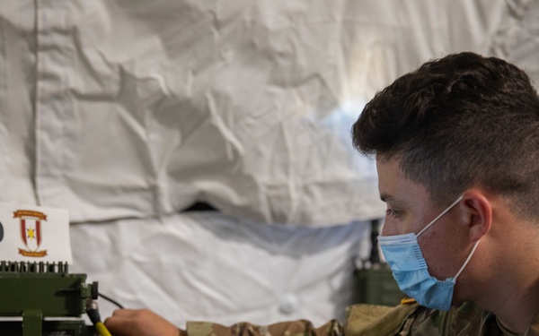 44 Medical Brigade Radio Operator Conducts Communication Checks During GR 21