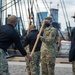 Soldiers from the 826th Military Intelligence Battalion participate in an 1812 naval heritage event, featuring pike drills, gun drills and a tour