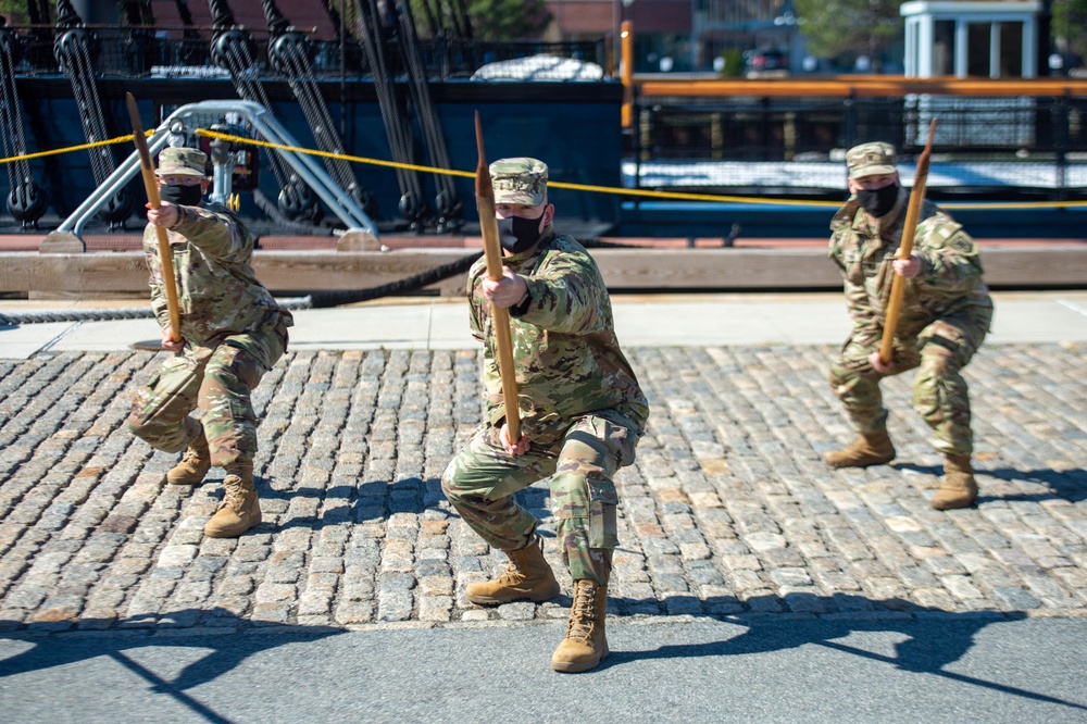 Soldiers from the 826th Military Intelligence Battalion participate in an 1812 naval heritage event, featuring pike drills, gun drills and a tour