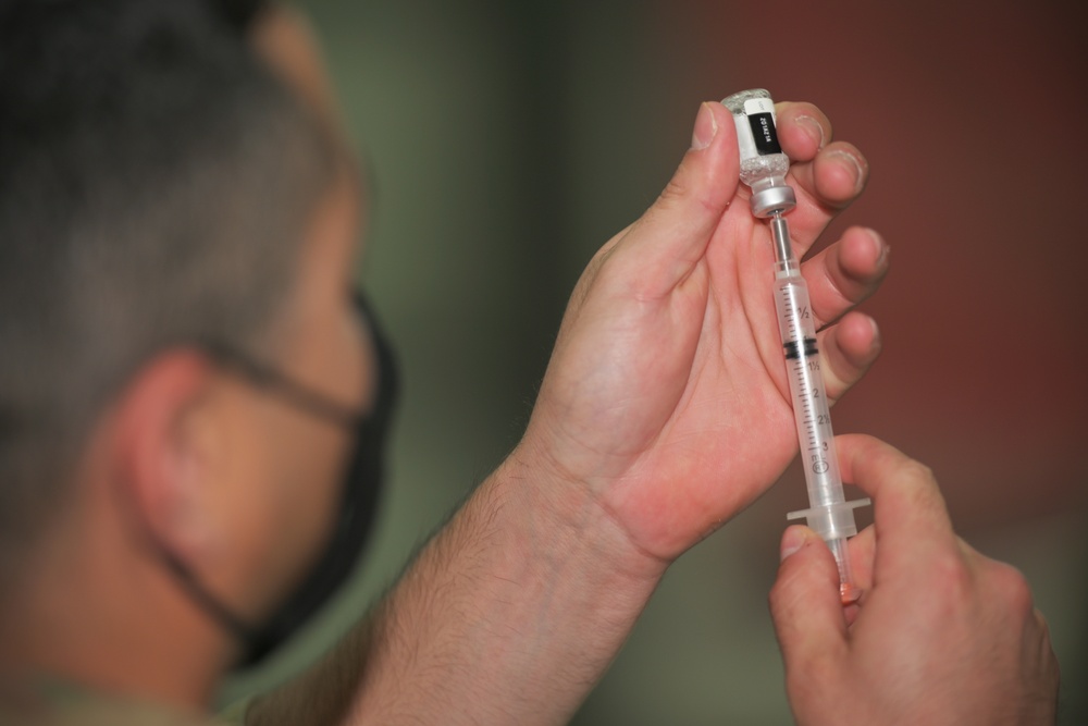 Medics distribute next batch of COVID-19 vaccines