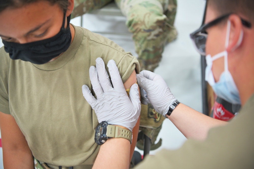 Medics distribute next batch of COVID-19 vaccines