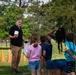 Airmen, children plant tree for Arbor Day