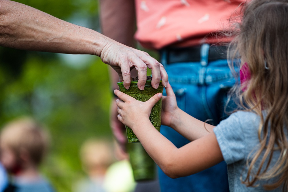 Airmen, children plant tree for Arbor Day