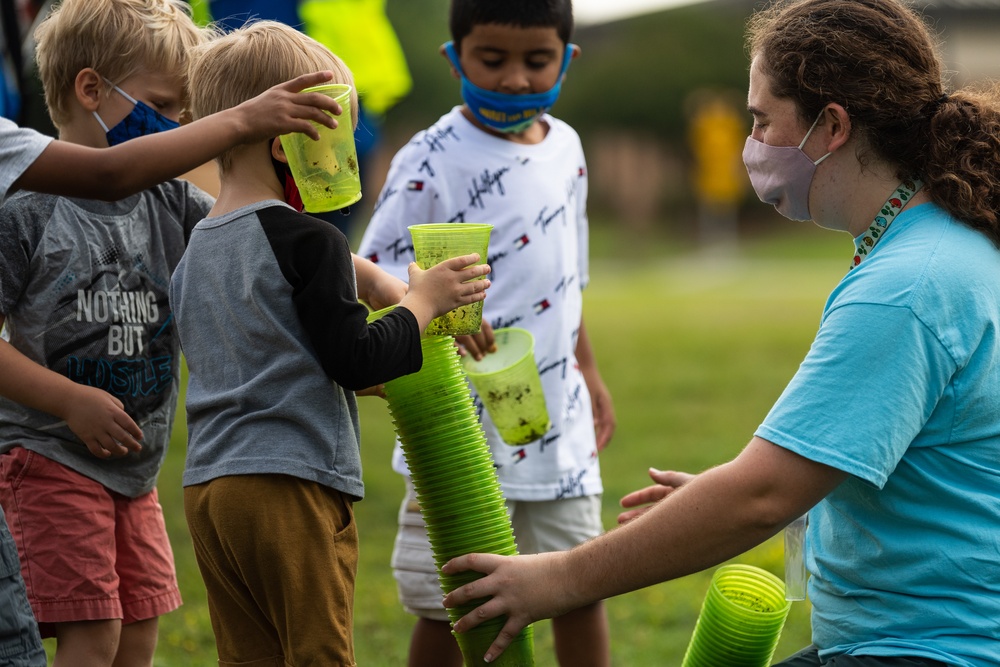 Airmen, children plant tree for Arbor Day