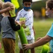 Airmen, children plant tree for Arbor Day