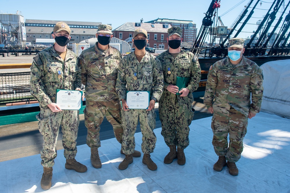 Soldiers from the 826th Military Intelligence Battalion participate in an 1812 naval heritage event, featuring pike drills, gun drills and a tour