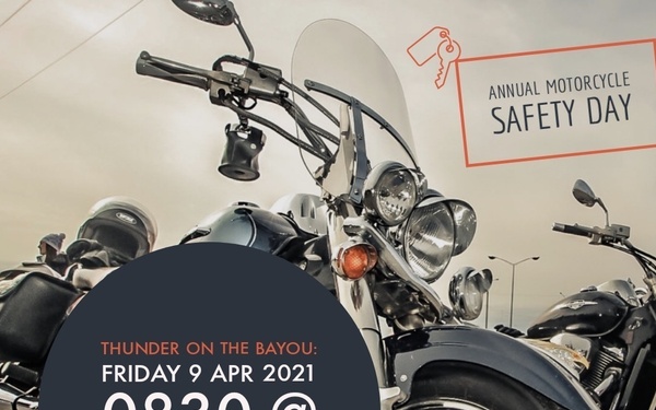 This is a promotional flyer for an Annual Motorcycle Safety Day event called 'Thunder on the Bayou.' The event is scheduled for Friday, April 9, 2021, at 0830 hours at Chapel 2. The background features a low-angle close-up photograph of cruiser-style motorcycles with chrome detailing.