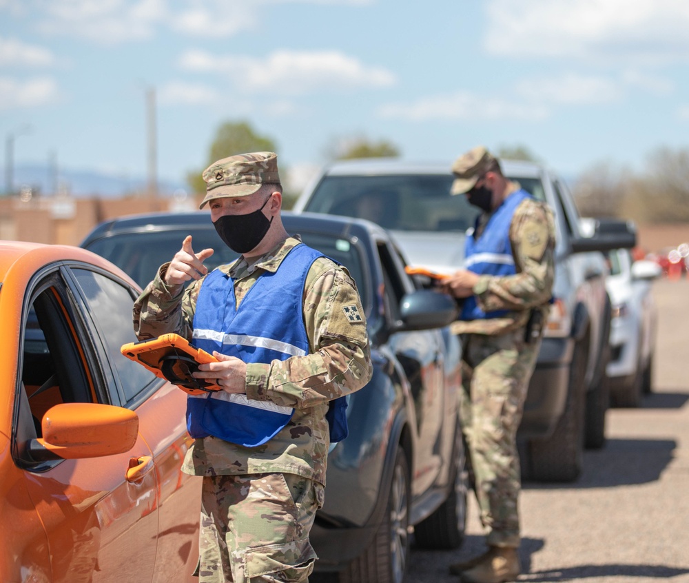 2nd Stryker Brigade Combat Team, 4th Infantry Division Soldiers vaccinate members of the Pueblo community