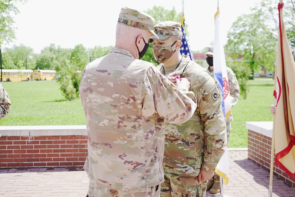 Staff Sgt. Rey Cirino receives the meritorious service medal