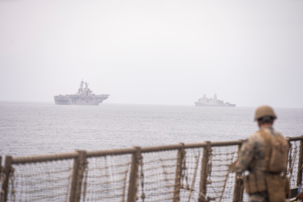 U.S. Marines aboard USS Pearl Harbor provide security during strait transit training