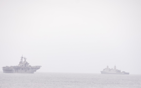 U.S. Marines aboard USS Pearl Harbor provide security during strait transit training
