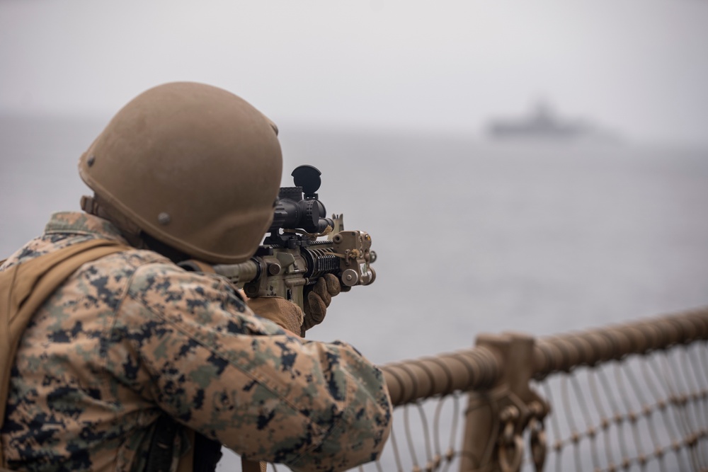 U.S. Marines aboard USS Pearl Harbor provide security during strait transit training