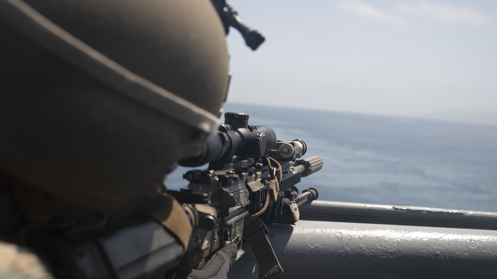 U.S. Marines aboard USS Pearl Harbor provide security during strait transit training