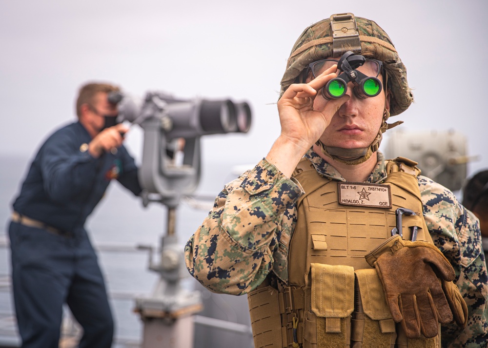 U.S. Marines aboard USS Pearl Harbor provide security during strait transit training