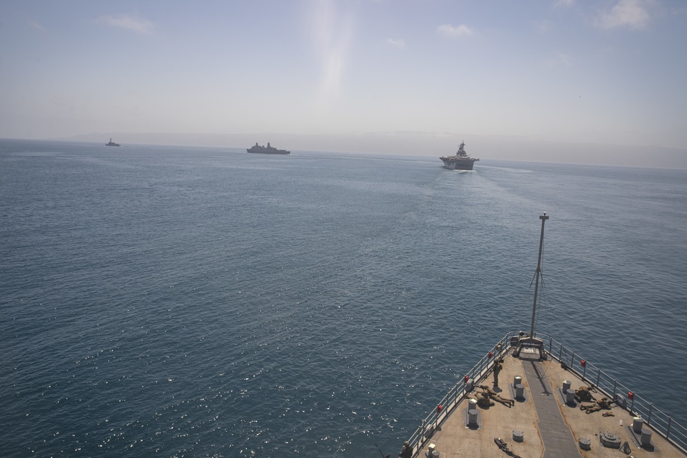 U.S. Marines aboard USS Pearl Harbor provide security during strait transit training