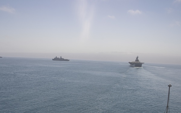 U.S. Marines aboard USS Pearl Harbor provide security during strait transit training