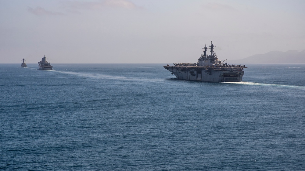 U.S. Marines aboard USS Pearl Harbor provide security during strait transit training