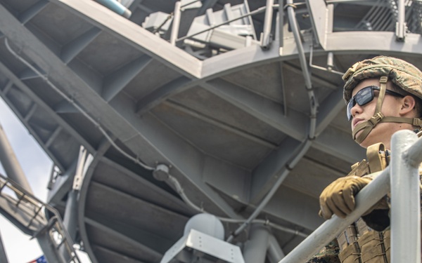 U.S. Marines aboard USS Pearl Harbor provide security during strait transit training