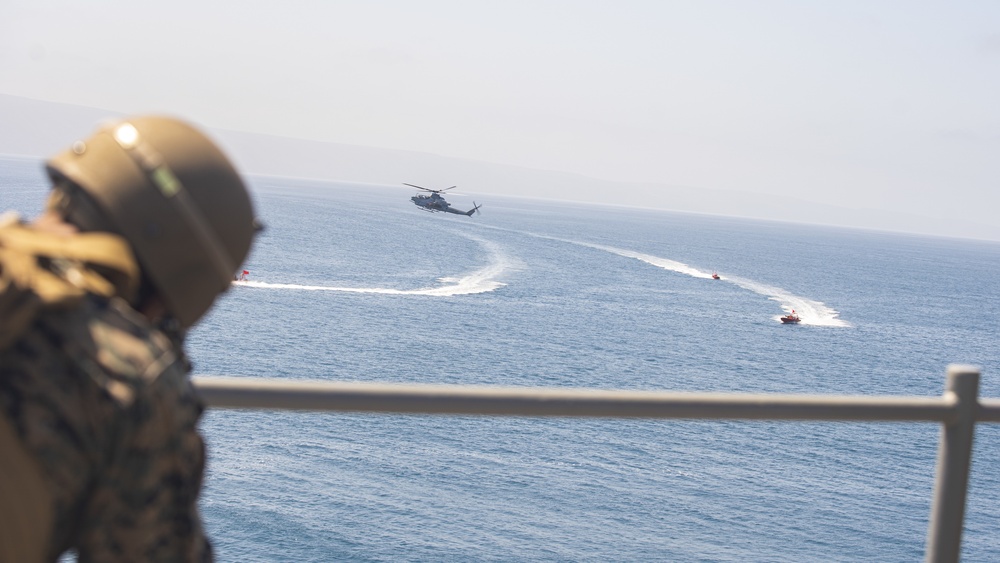 U.S. Marines aboard USS Pearl Harbor provide security during strait transit training