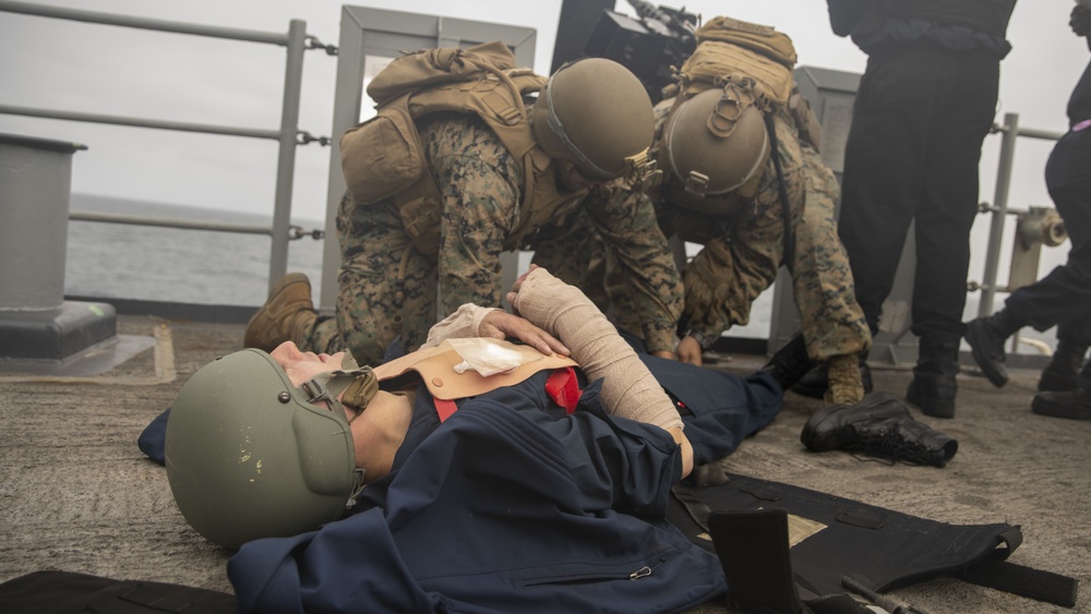 U.S. Marines aboard USS Pearl Harbor provide security during strait transit training